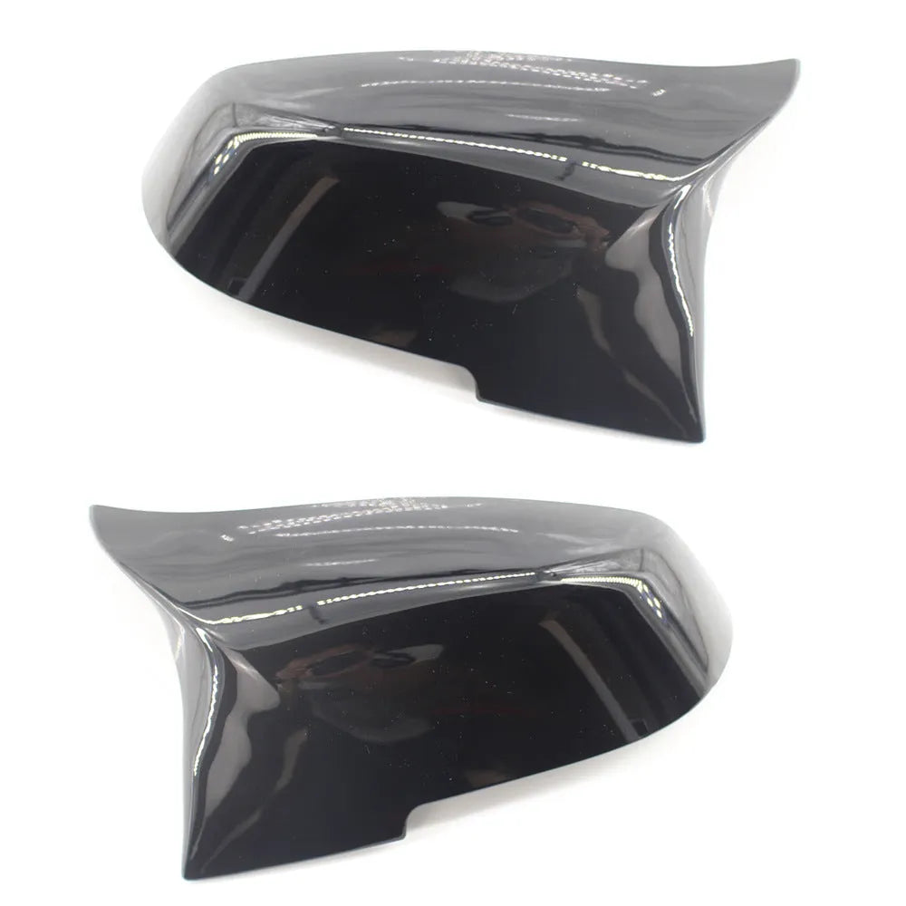 Pair of dark bright black BMW horn-style rear-view mirror replacement shells.