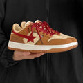 Brown women's platform sneakers with sequin details and a lace-up front.