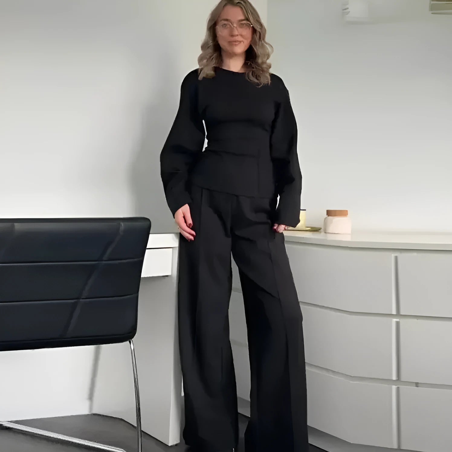 Women's black polar fleece suit set with pleated O-neck long sleeve top and wide leg trousers