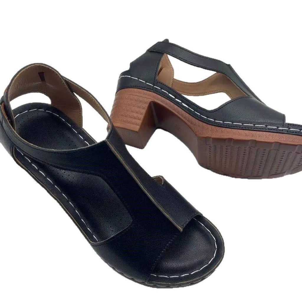 Women's white peep toe wedge sandals with a Roman style fish mouth toe and ankle buckle on a low rubber sole.
