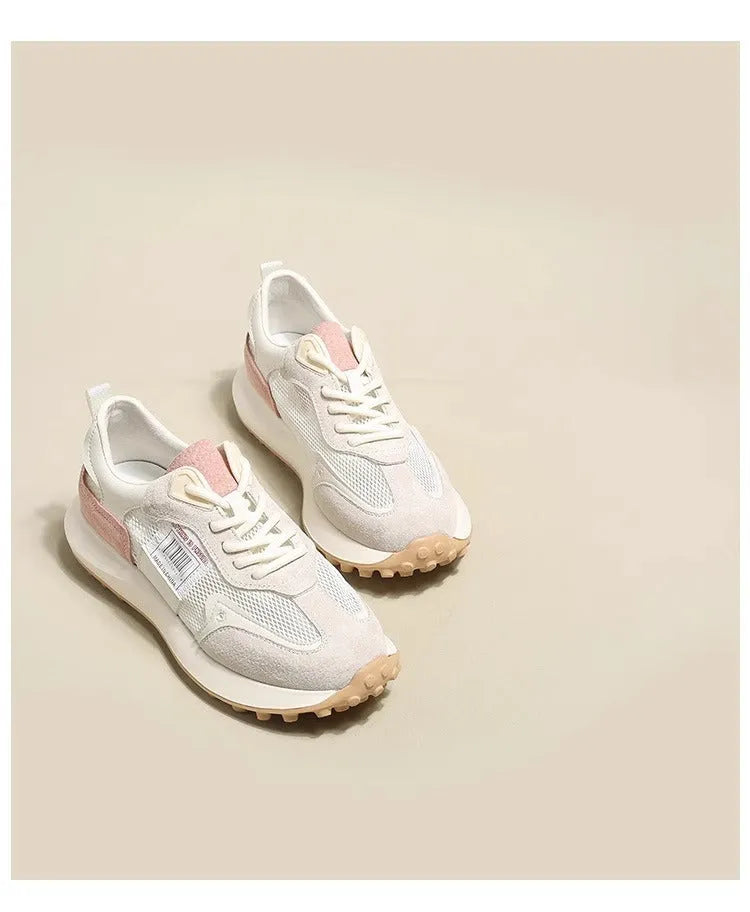 Women's gray and pink retro sneakers with mesh lining, rubber sole, and low-top design