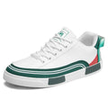 Men's white and green canvas casual shoes with mesh ventilation panels on the upper.