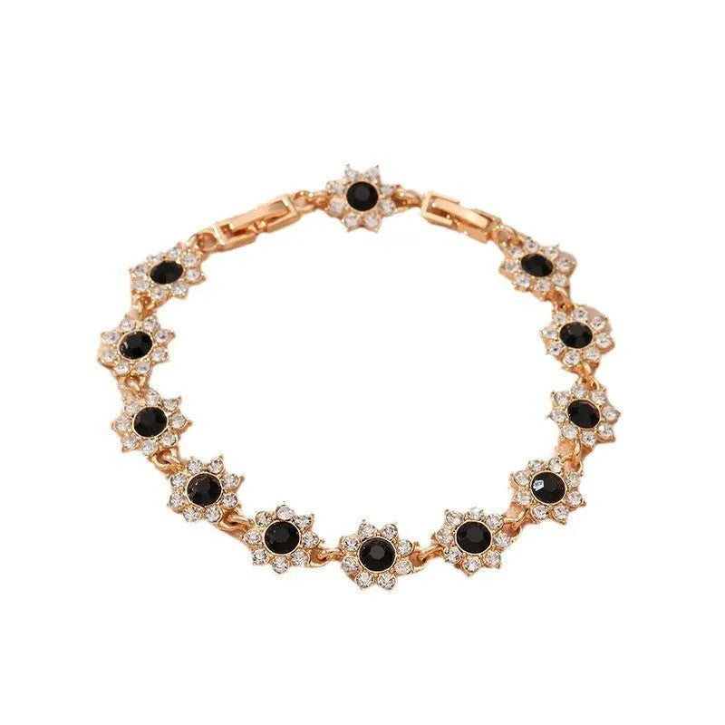 Flower design fashion bracelet in zinc alloy showing electroplated colour options with crystal and simulated diamond elements