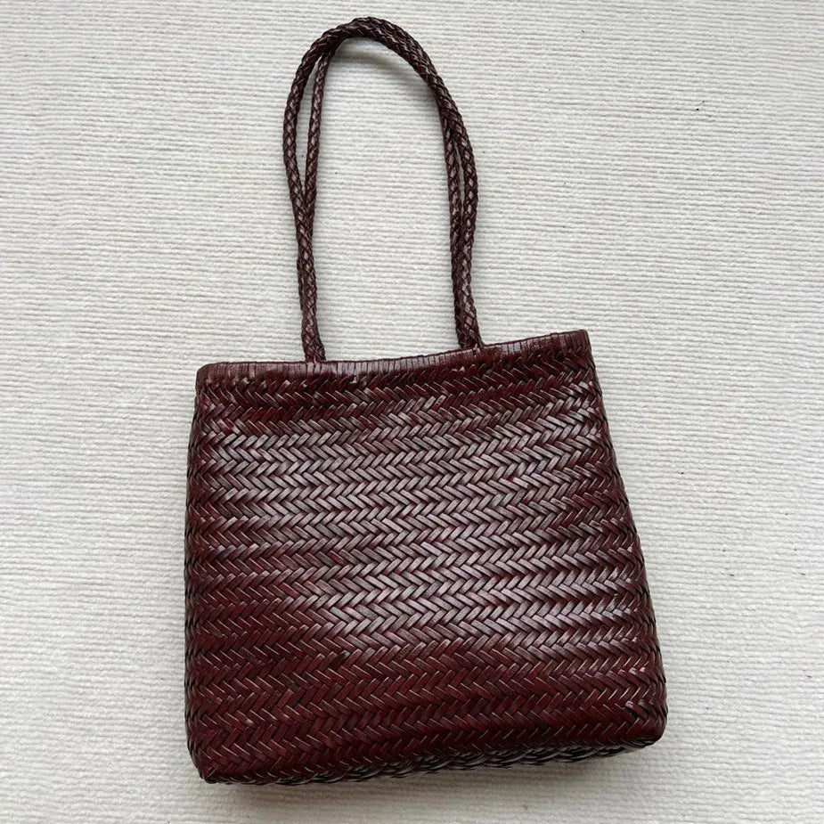 Handmade brown woven leather tote bag with three-dimensional pocket and shoulder strap