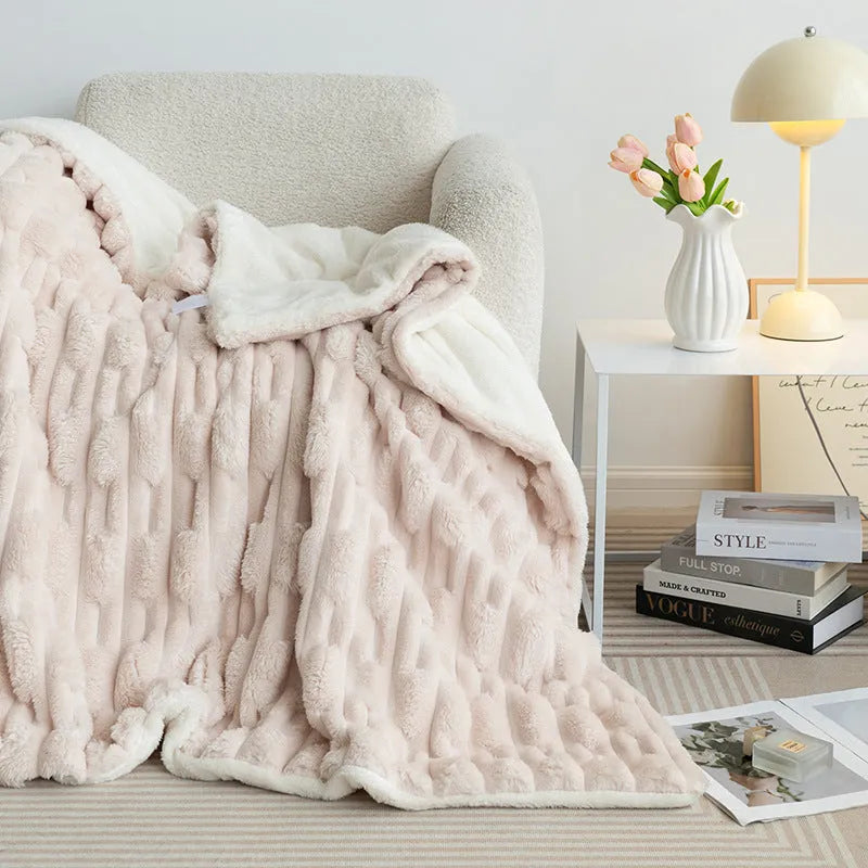 Rabbit Bejirog solid colour polyester fibre flange blanket on a bed, available in multiple sizes and colours