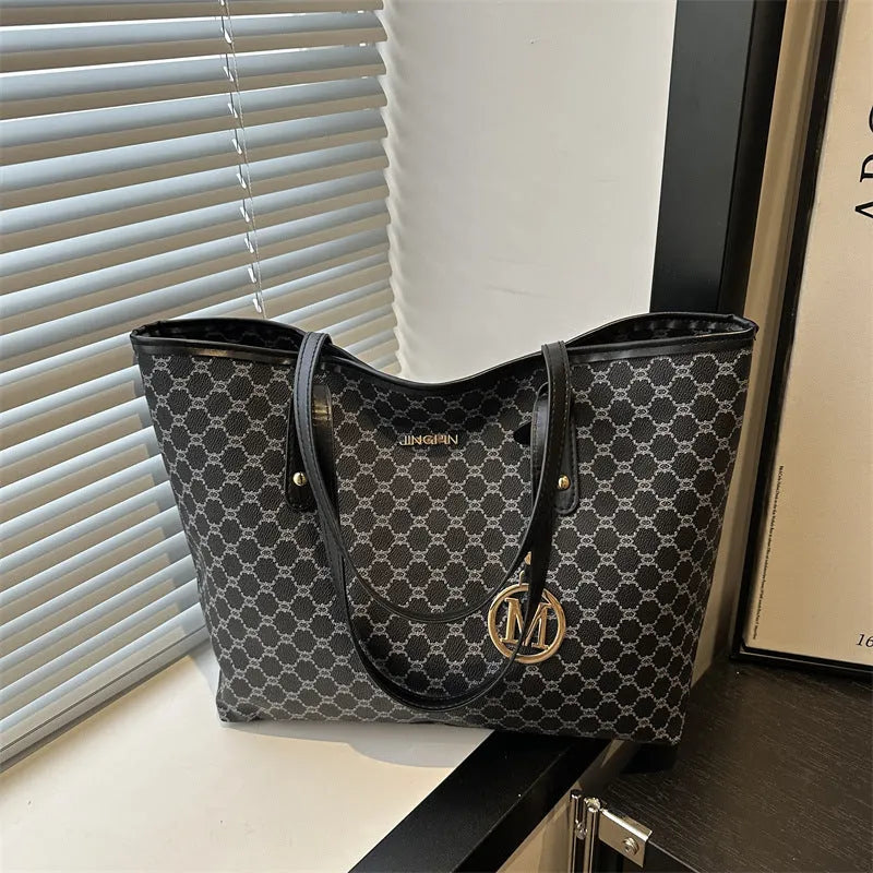 Women's structured PU leather shoulder bag with street trend sewing details shown in neutral colour options