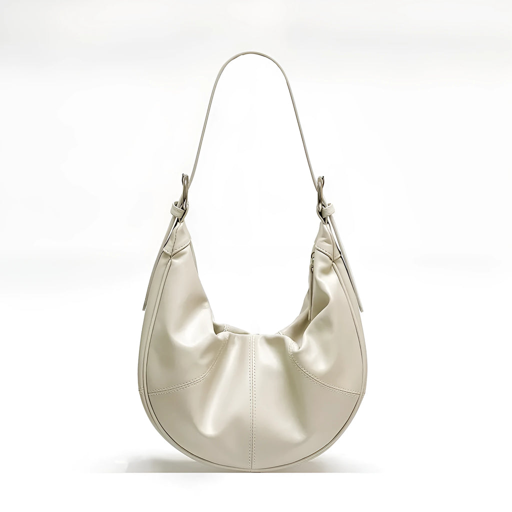 Women's soft cowhide leather shoulder bag with dumpling shape showing sandwich pocket and double joint straps