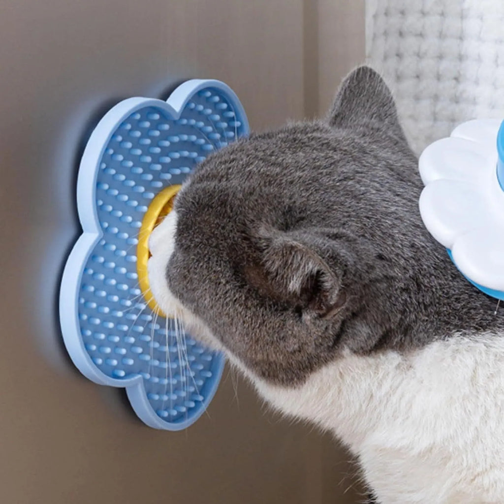Flower-shaped silicone pet licking mat with suction cups on back in blue, grey, pink, purple, or red