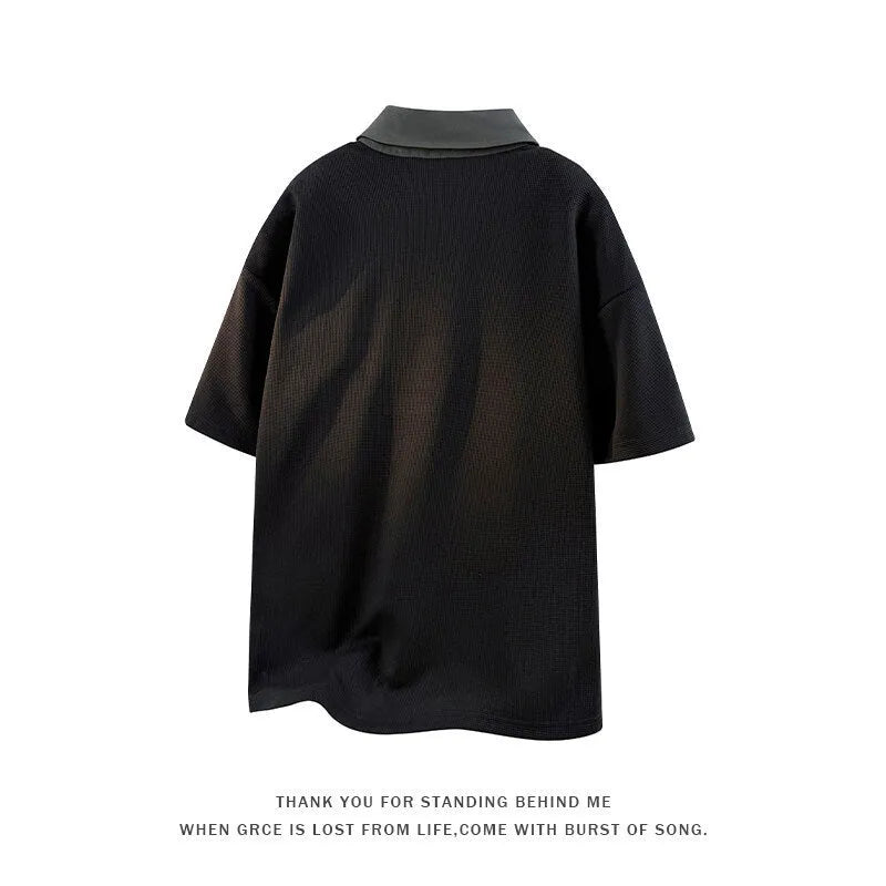 Men's black padded Henry collar short sleeve polo sweater made from thin spandex knit.