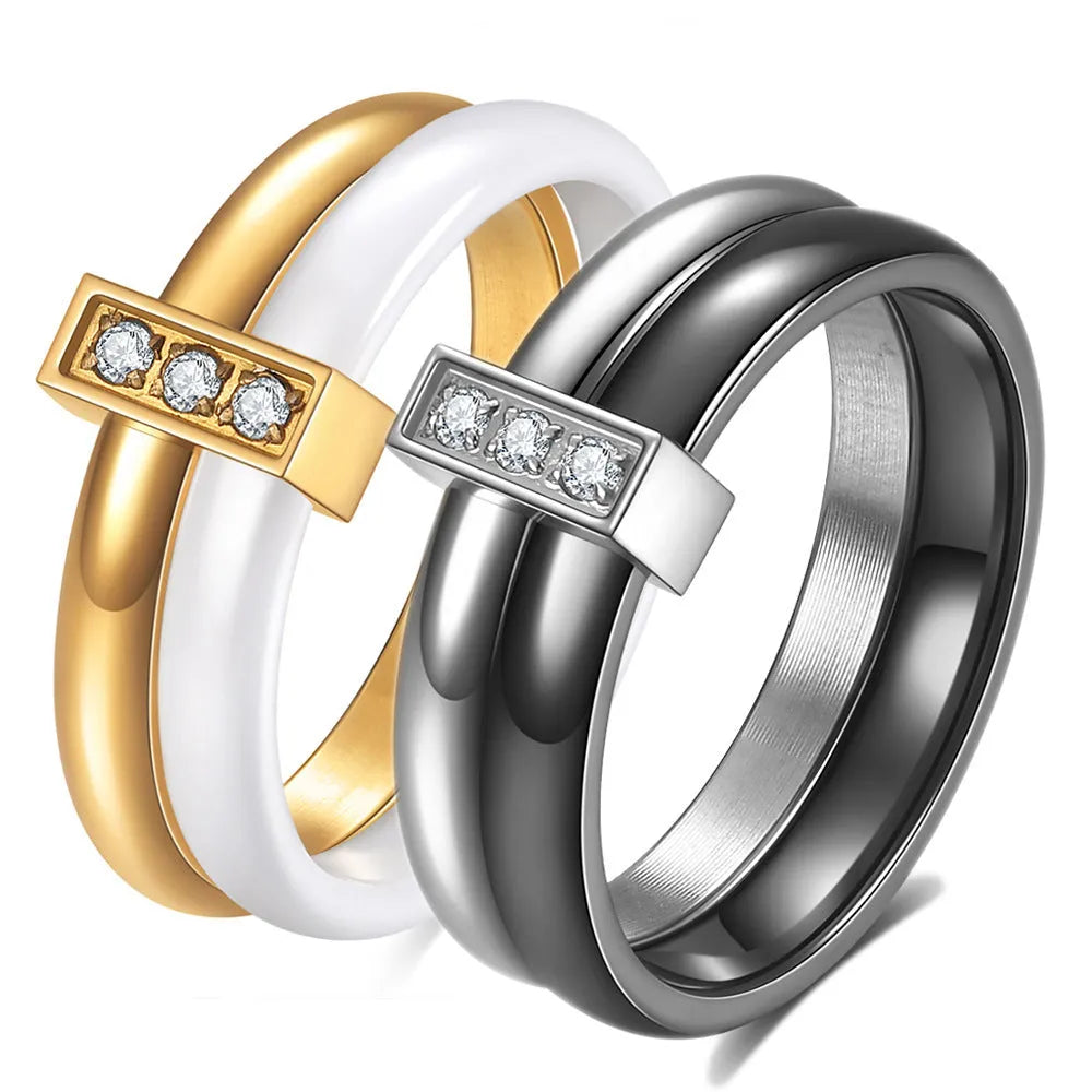 Geometric ceramic women's ring with zirconium detailing in steel black or gold white finish