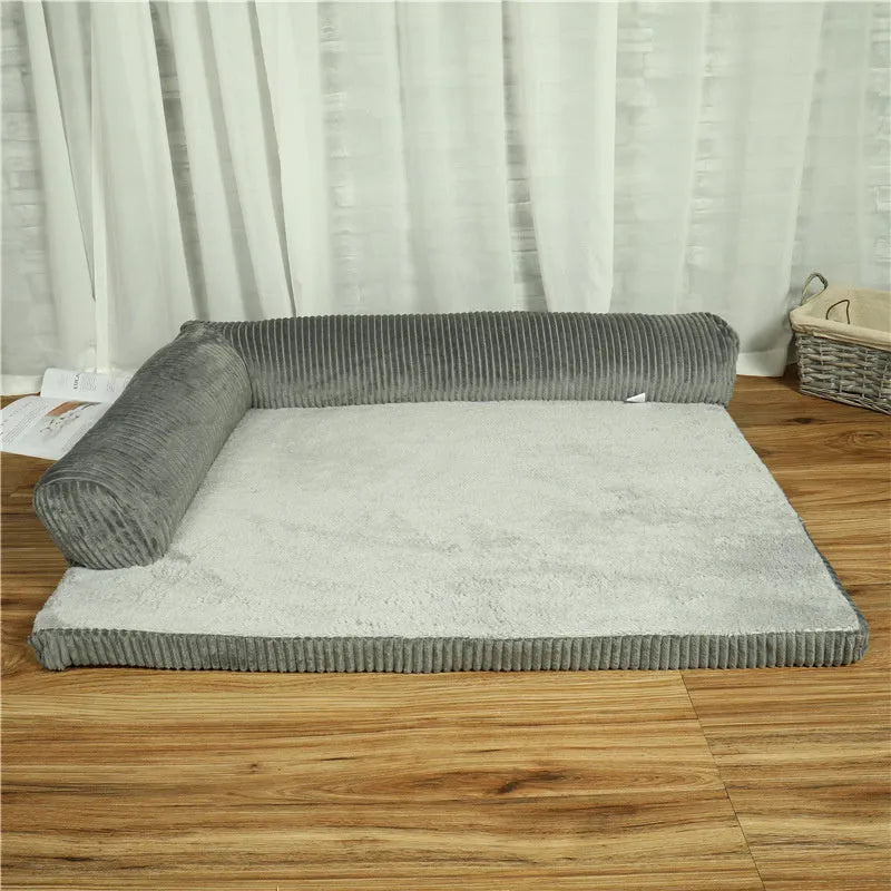 Corduroy dog sofa bed with raised sides in grey colour, showing non-slip base and cushioning.