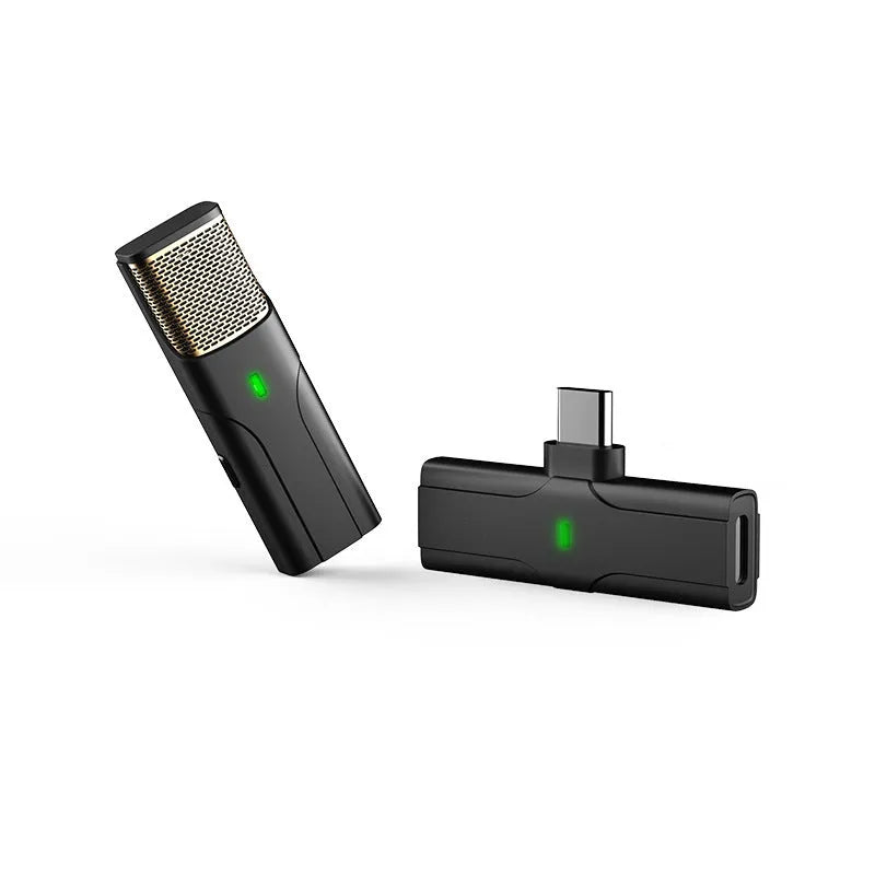 Black wireless lavalier lapel microphone with clip and Type-C charging cable on a table.