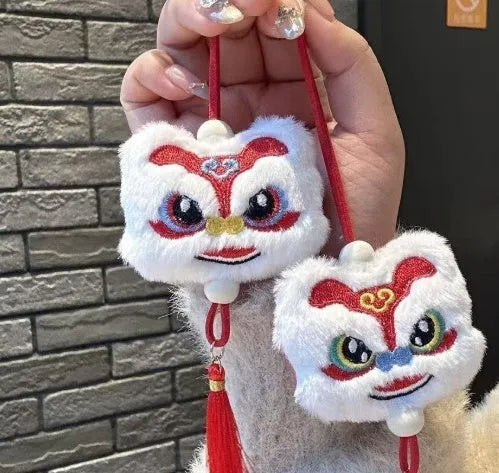 Chinese style blue and yellow plush lion keychain ornament with star stone detail and tassel