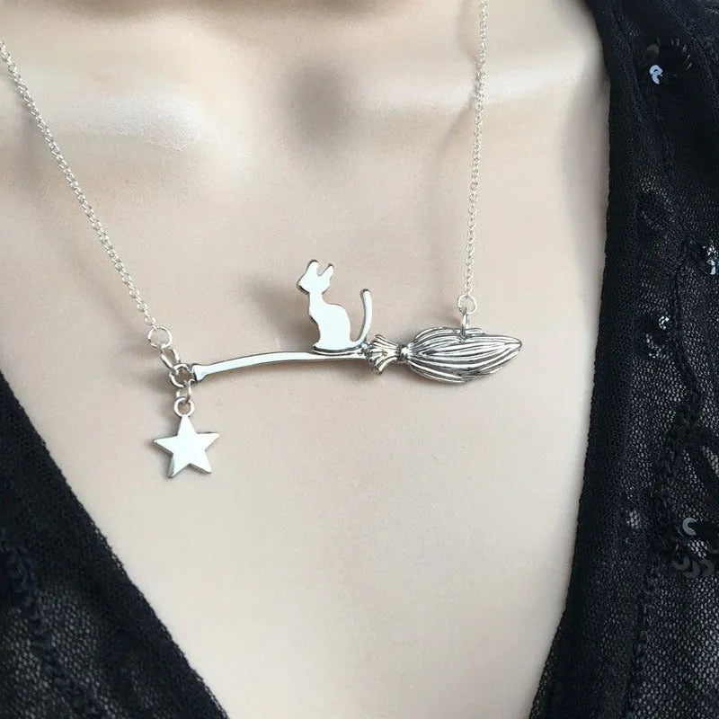 A lightweight alloy necklace with a simple black cat pendant, shown in gold and silver finish options.
