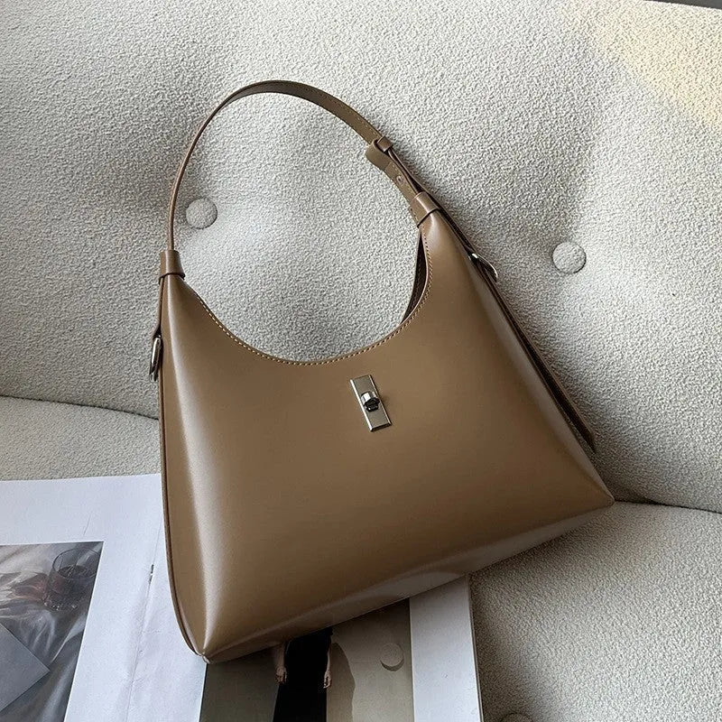 Genuine leather dumpling-shaped crossbody bag in apricot colour with shoulder strap
