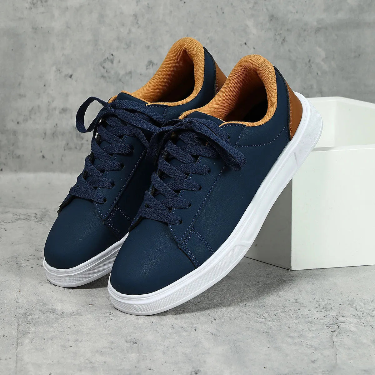Women's beige brown platform skateboard sneakers with a cross strap and flat rubber sole.