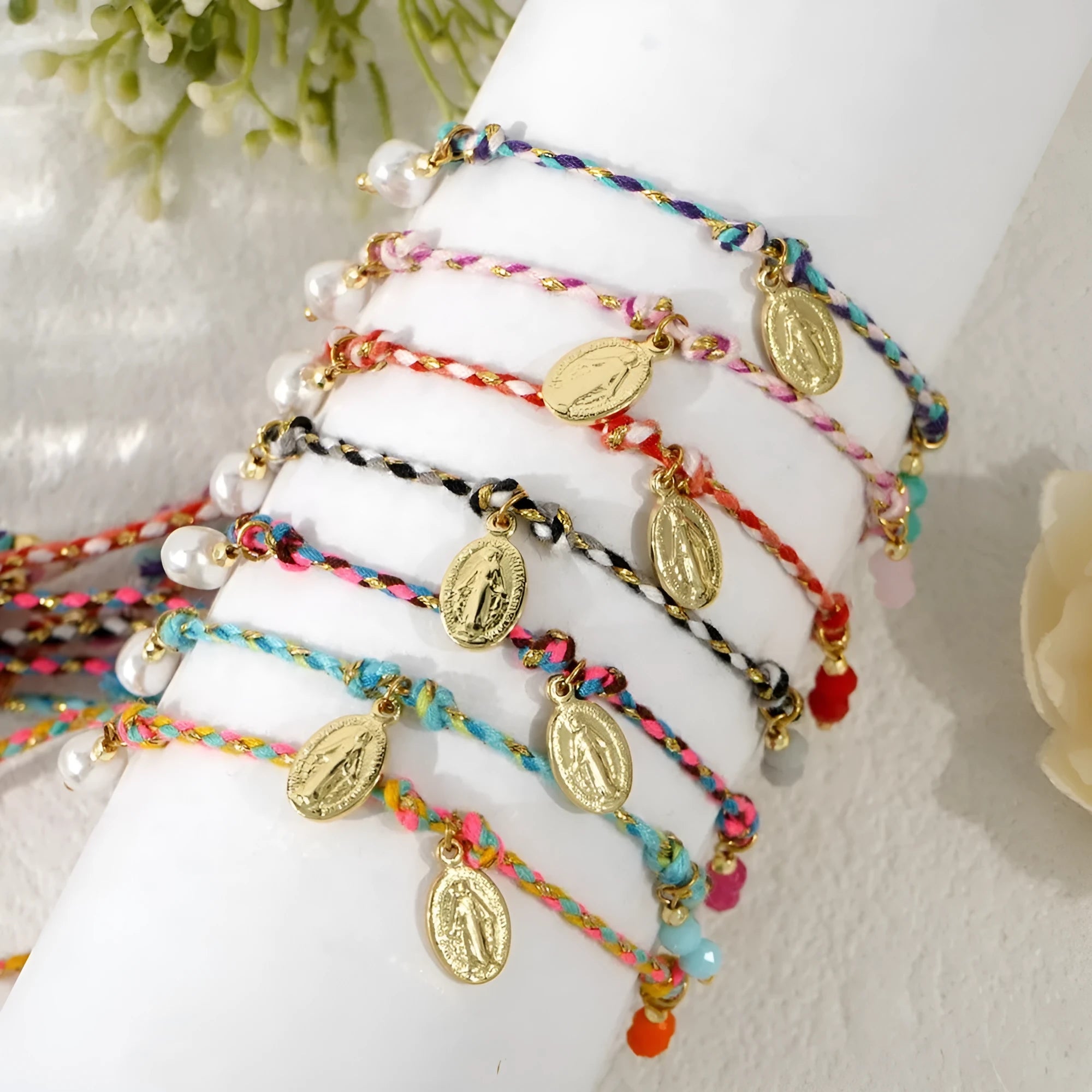Ethnic style women's bracelet handmade from colourful braided rope with woven carrying strap tag design
