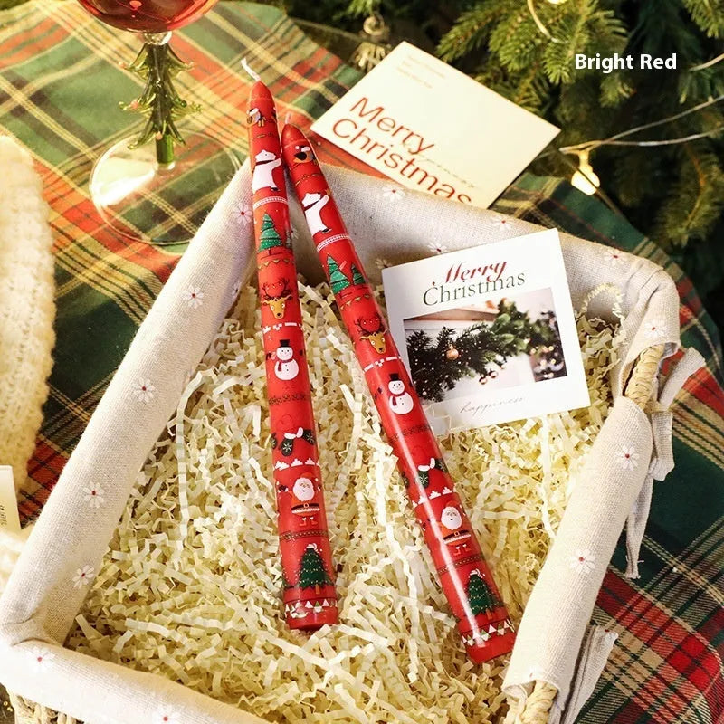Christmas printed paraffin cylinder candle in bright red, 2.2x25cm, on a table