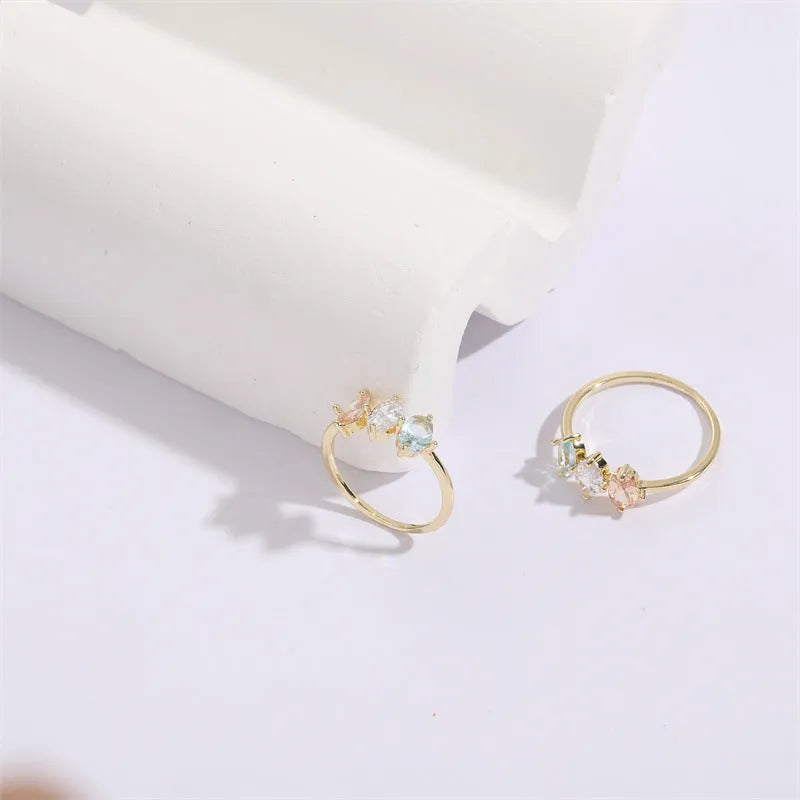 Geometric triangle ring with horse eye tricolor zircon in electroplated 14k gold colour on copper