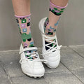 Women's silver lace-up sports-style heeled shoe with a bow detail and round toe.