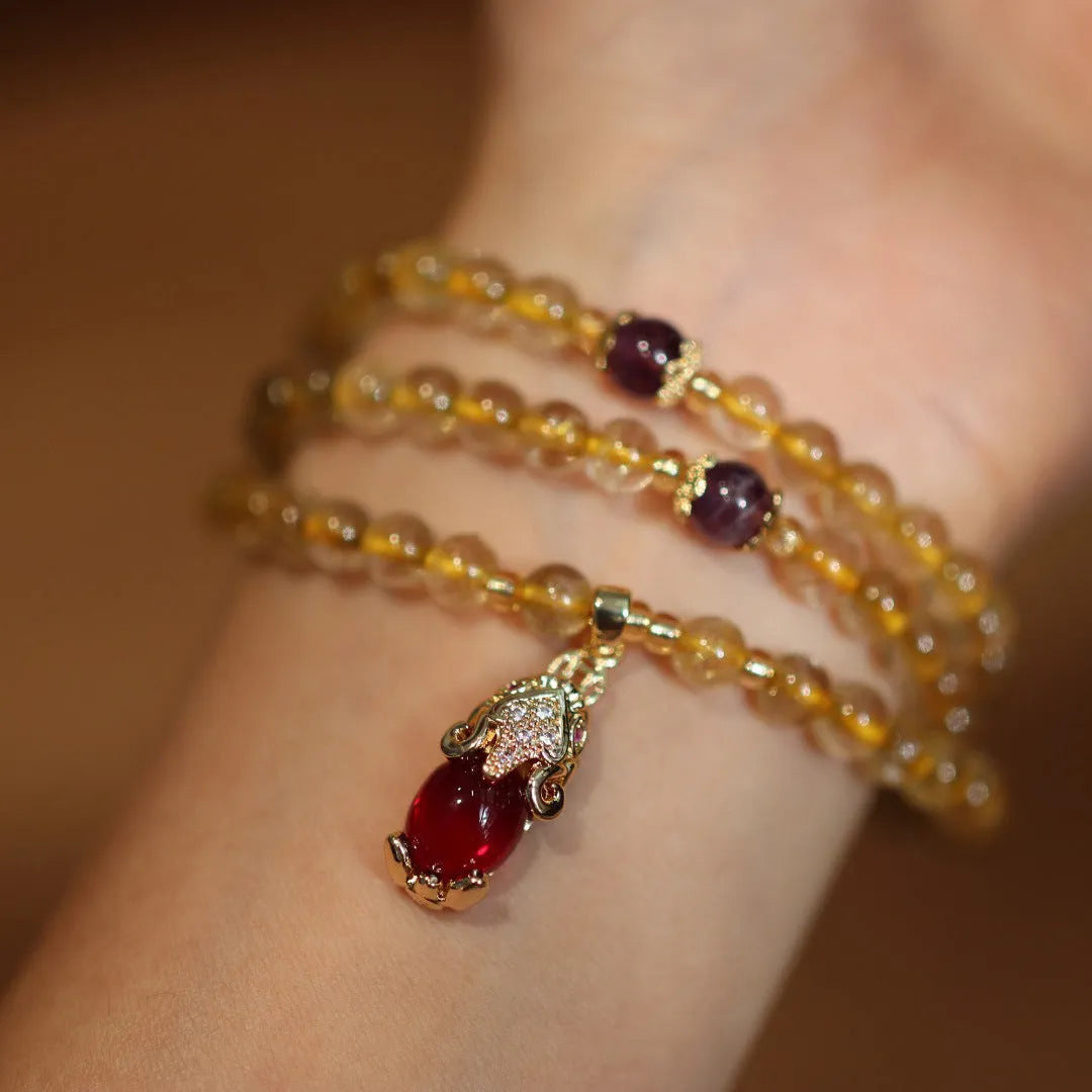 Natural Brazilian gold rutilated quartz bracelet with three circles and hanging chopsticks design