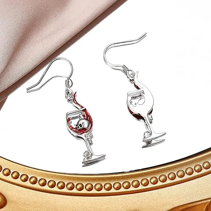 Geometric zinc alloy dangle earrings featuring a detailed Halloween skull charm with an electroplated metallic finish.