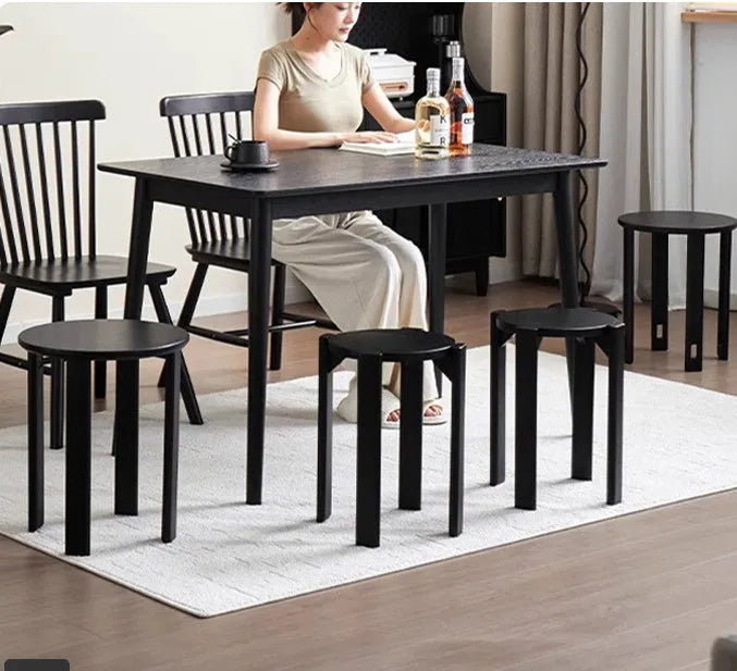 Stackable iron dining stool with round seat and metal frame in modern design