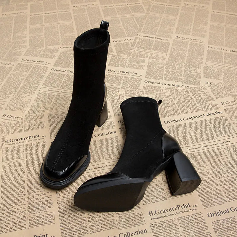 Genuine leather women's short martin boots in black matte finish with high heel and rubber sole