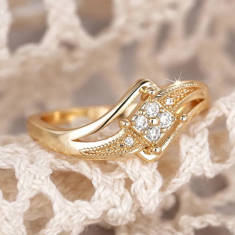 Yellow gold coloured copper diamond ring with micro inlaid zircon detail and geometric quadrangle design.