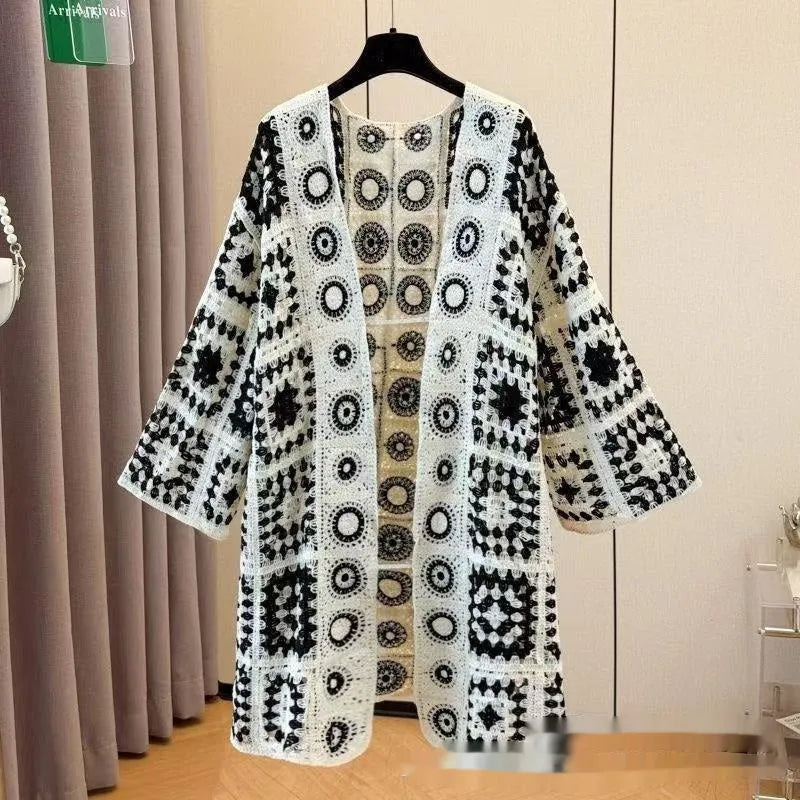 Ladies' loose embroidered thin knit cardigan in brown, front view on model