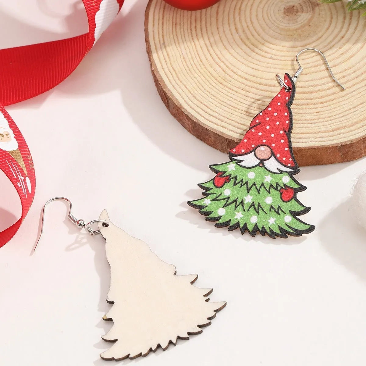 Wooden Christmas earrings showing Christmas tree design and water drop snowman design with festive printing