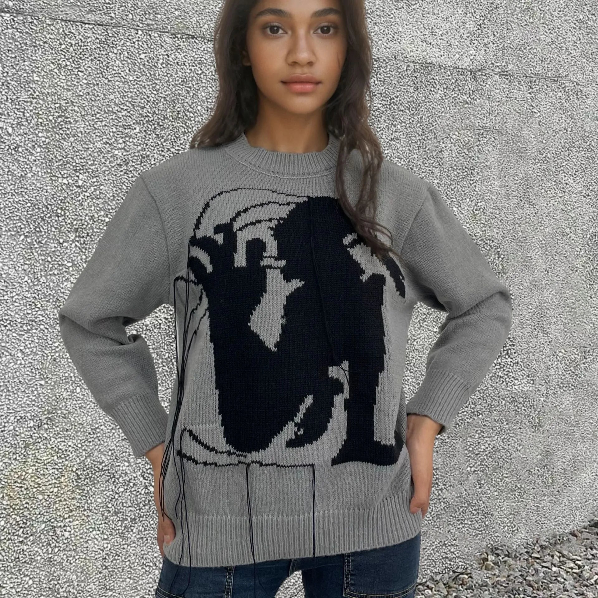Women's loose Alpaca wool sweater with tassel design and abstract pattern in grey colour