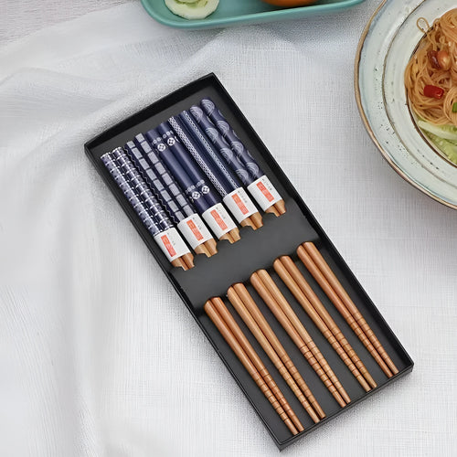 Set of five pairs of bamboo chopsticks with Japanese cartoon patterns in a gift box.