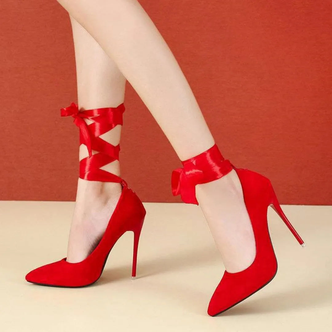 Black pointed toe high heel with lace ankle strap on a 12cm heel.
