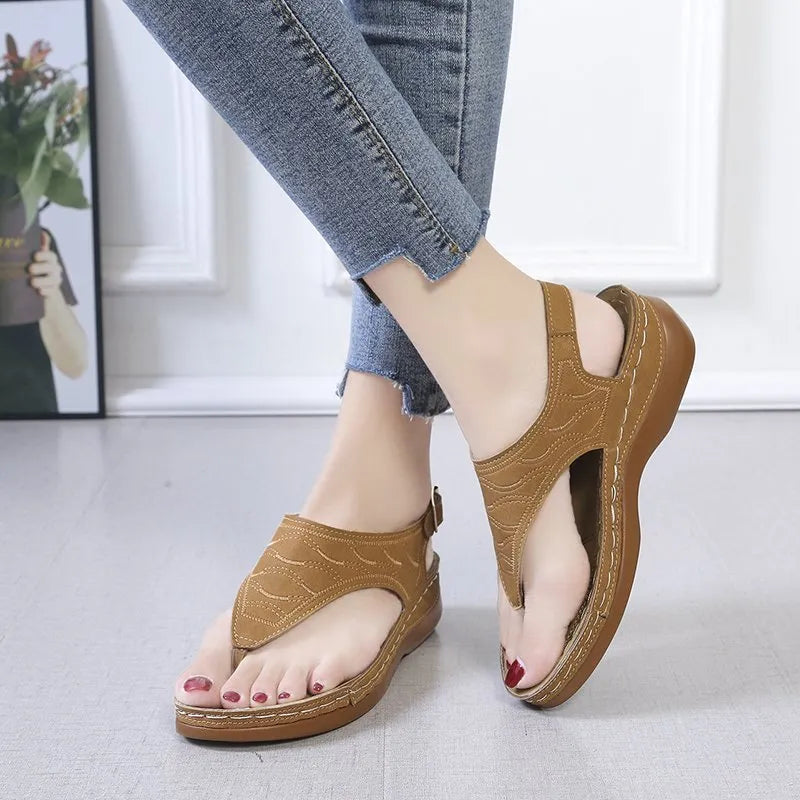 Women's casual wedge heel flip flop sandals with adjustable back strap in red vegan leather