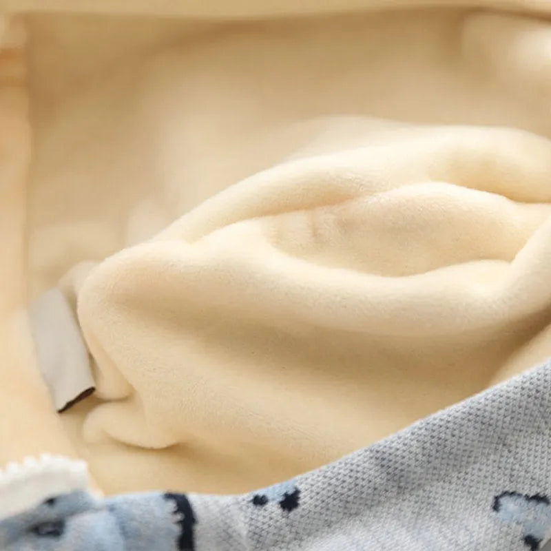 Blue cotton dog sweater with front zipper closure shown on small dog