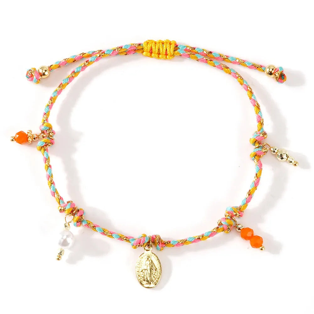 Ethnic style women's bracelet handmade from colourful braided rope with woven carrying strap tag design