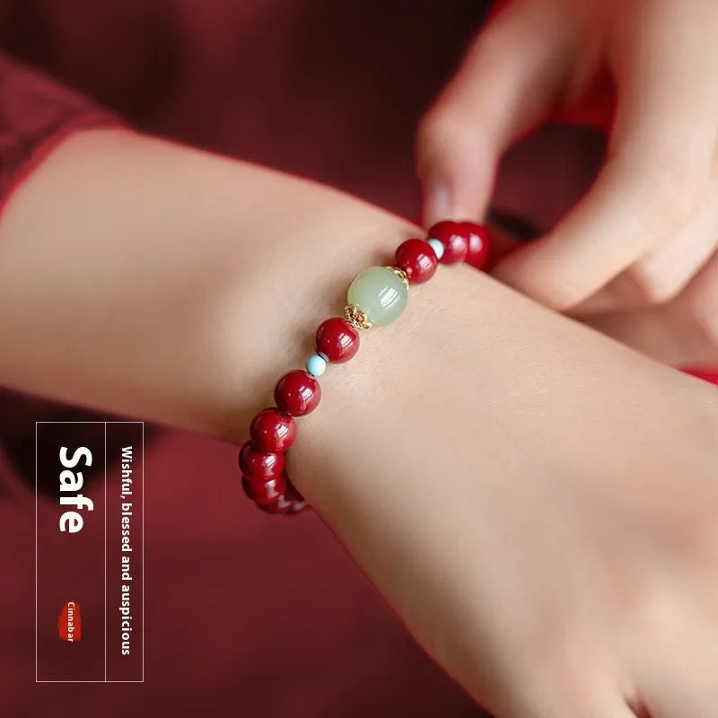 Geometric cinnabar and Hetian jade bead bracelet in purple gold sand colour on a wrist.
