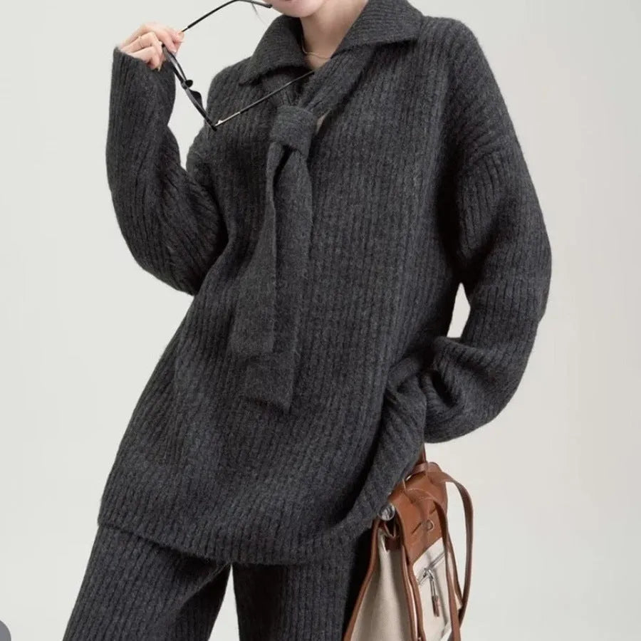 Beige imitation cashmere sweater suit two-piece set with knit top and trousers on a hanger