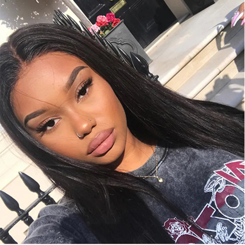 Long straight black wig with centre part and bangs on a mannequin head