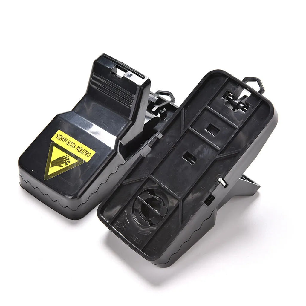 Six black plastic snapping mouse traps showing dimensions and smooth surface