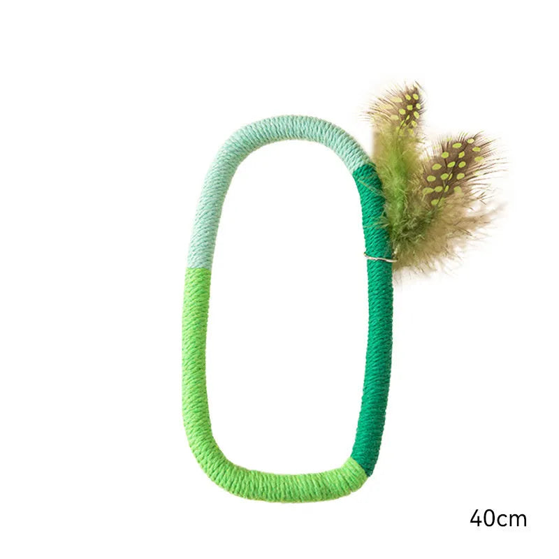 Green circular cotton rope cat toy with white feathers attached for chewing and interactive play.