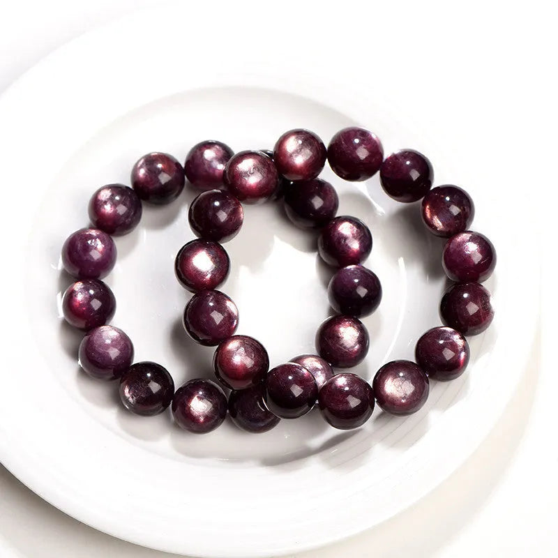 Purple lepidolite crystal round bead bracelet showing polished surface and geometric bead arrangement