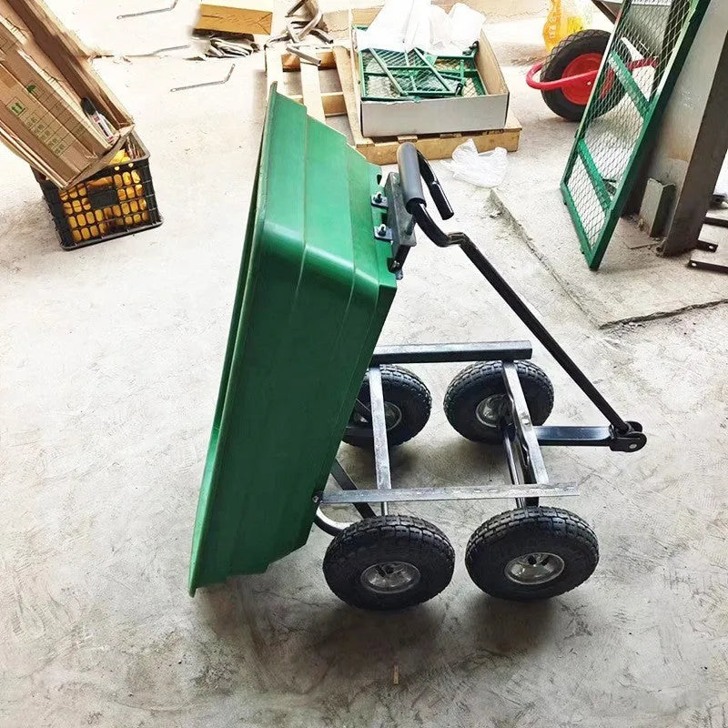 Green four-wheel plastic dumptruck with a large haulage body on a steel-reinforced frame.