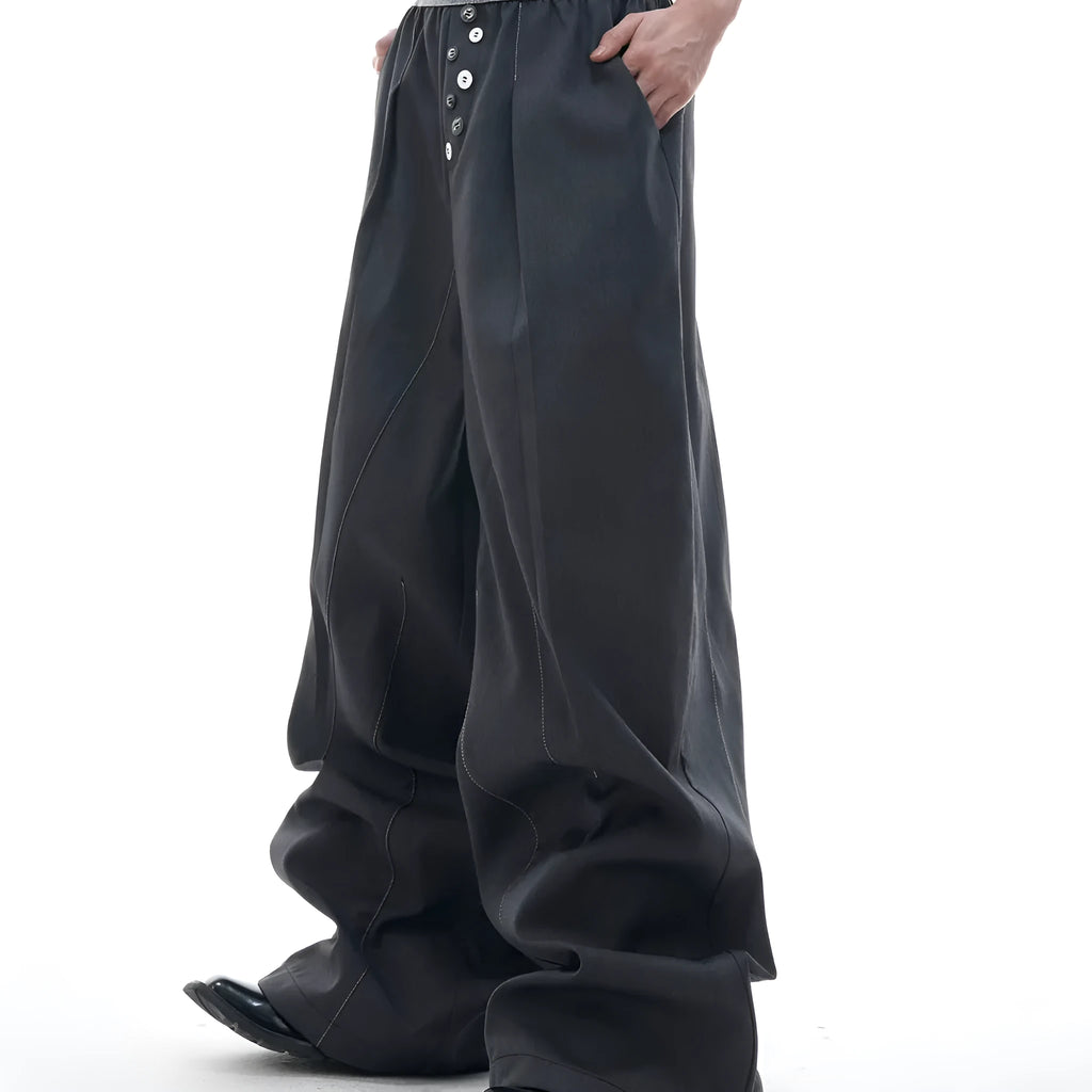Men's high-waisted straight-leg casual trousers in black with button fly front, showing relaxed fit.