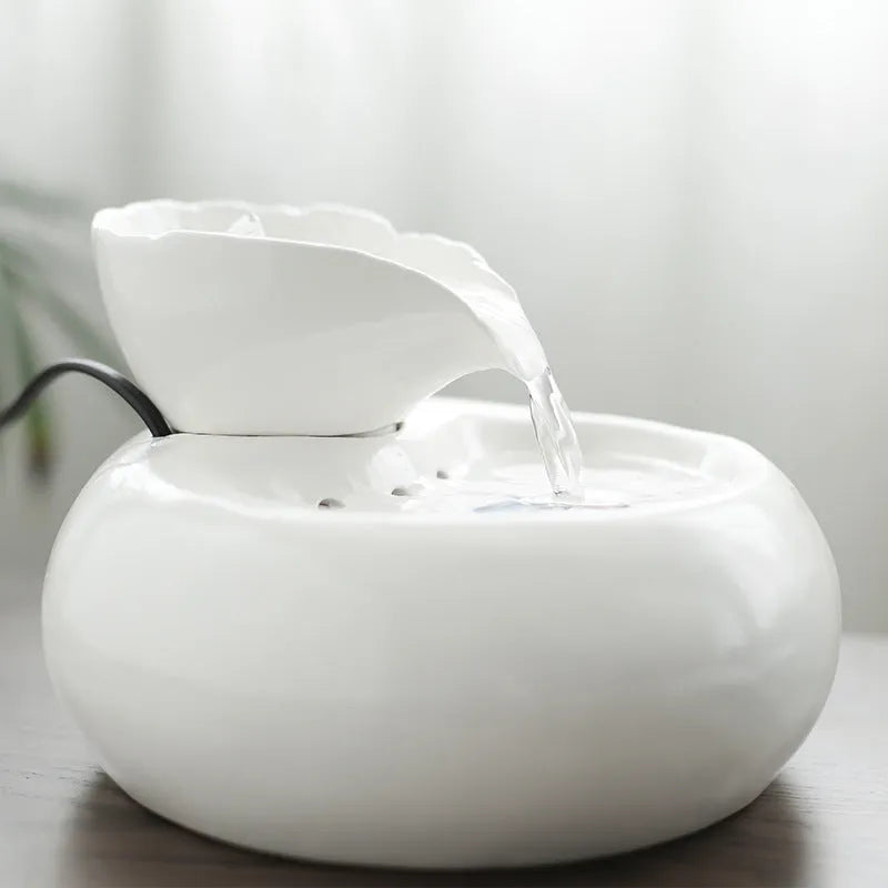 White ceramic automatic cat water dispenser with leaf-shaped bowl and pump
