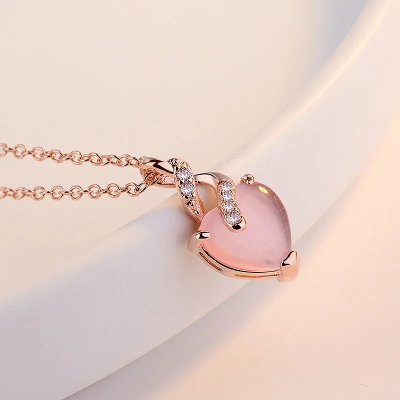 Women's heart-shaped pink synthetic crystal pendant necklace with rose gold electroplated chain