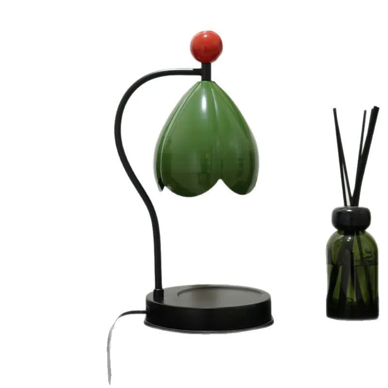 Linglan modern style melting wax fragrance lamp with metal holder on a desk.