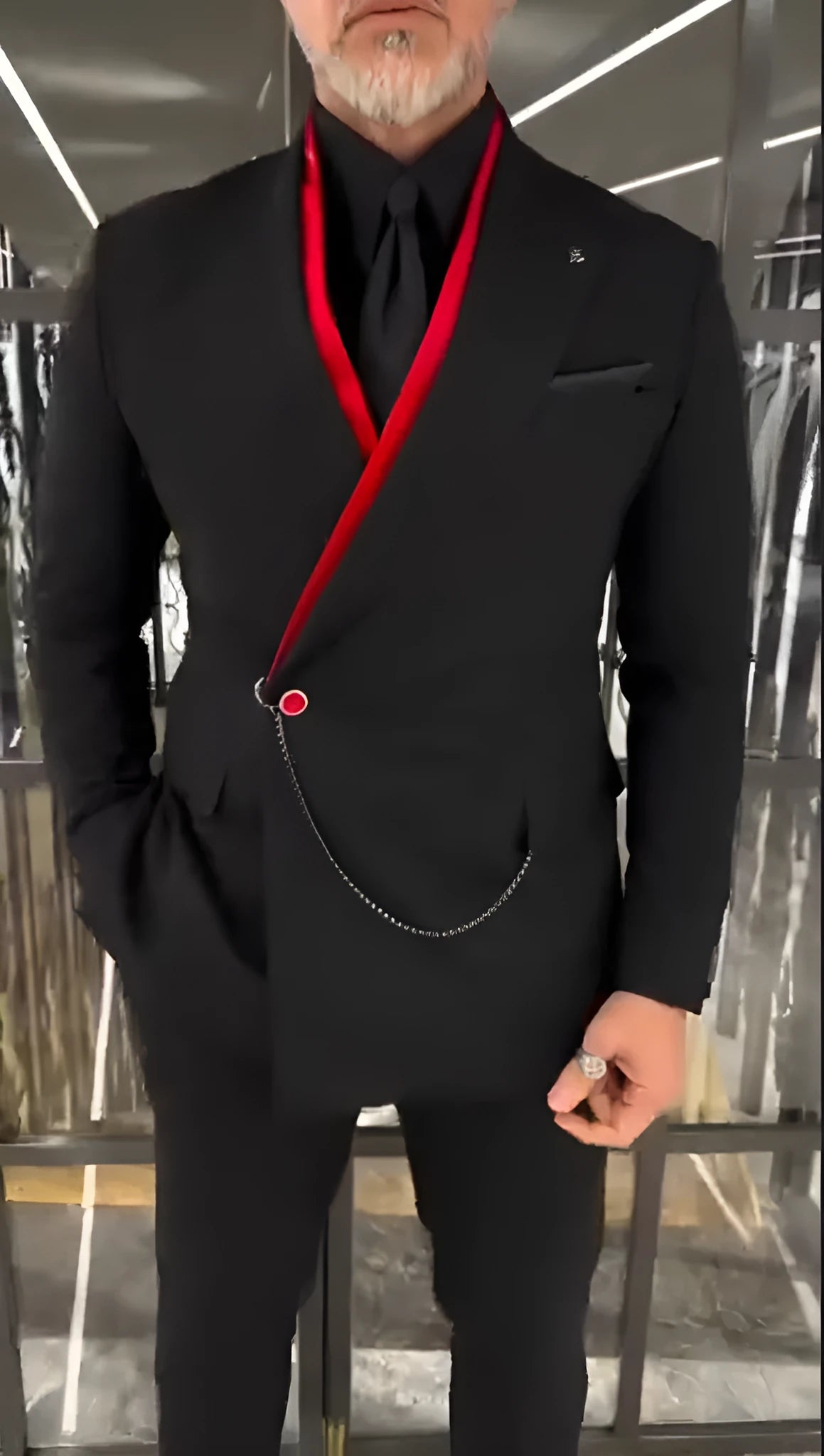 Fake double-layered black jacket with red inner lining and metal chain detail