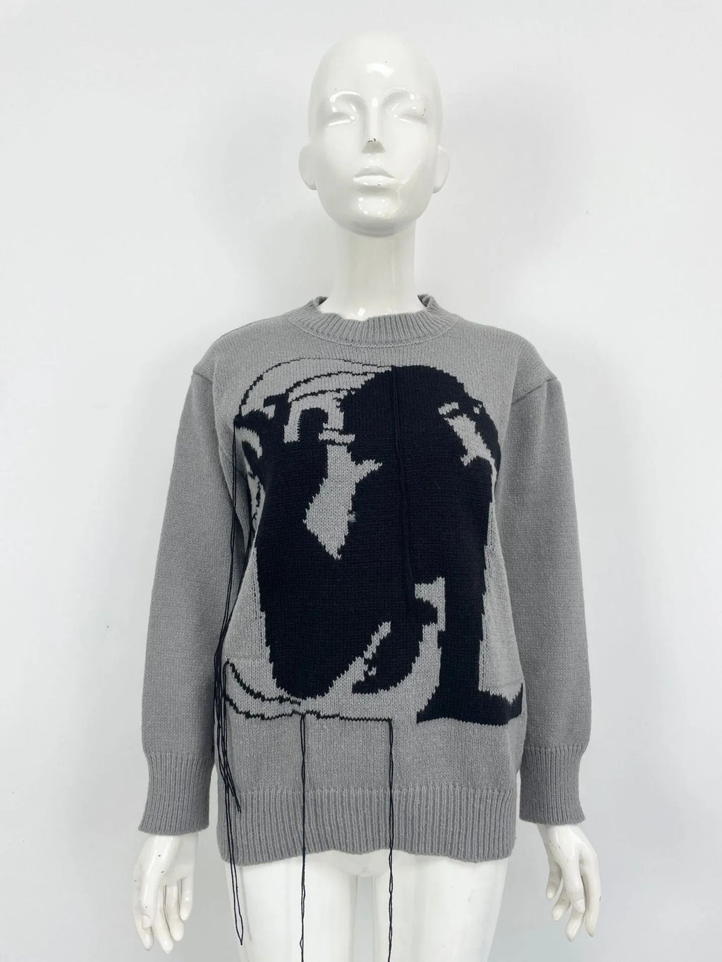 Women's loose Alpaca wool sweater with tassel design and abstract pattern in grey colour